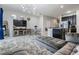 Well-lit living room offering an open floor plan, plush seating, and seamless flow to the kitchen at 7030 Summer Holly Pl, Riverview, FL 33578