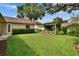 Manicured backyard featuring a pergola with a hammock offering a relaxing outdoor space at 905 Balsamina Dr, Brandon, FL 33510