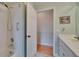 Bright bathroom features a shower and tub combination, plus a closet with hardwood floors at 905 Balsamina Dr, Brandon, FL 33510