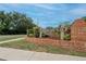 Entrance sign for Timber Pond III, landscaped with brick and greenery at 905 Balsamina Dr, Brandon, FL 33510
