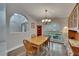 Inviting dining area with wood flooring, a chandelier, and ample natural light at 905 Balsamina Dr, Brandon, FL 33510