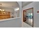 Open-concept design showcasing the foyer, dining area, and living room with wood floors at 905 Balsamina Dr, Brandon, FL 33510
