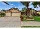Charming single-story home with a well-manicured lawn, mature tree, and a three-car garage at 905 Balsamina Dr, Brandon, FL 33510