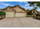 A beige single-story home with a well-kept lawn and three-car garage at 905 Balsamina Dr, Brandon, FL 33510
