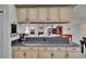 Bright kitchen featuring granite countertops and ample cabinetry with an opening overlooking the living area at 905 Balsamina Dr, Brandon, FL 33510