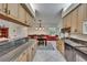 Spacious kitchen showcases granite countertops, stainless appliances, and a bright dining area at 905 Balsamina Dr, Brandon, FL 33510