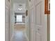 Hallway view of a bathroom with a soaking tub and tiled flooring and walls at 905 Balsamina Dr, Brandon, FL 33510