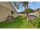 Well-maintained yard with a white fence and landscaping, providing privacy and curb appeal at 905 Balsamina Dr, Brandon, FL 33510