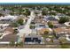 A neighborhood shot showing the home with solar panels in the back yard at 9128 Suffield Ct, Tampa, FL 33615