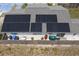 Home's roof with solar panels as viewed from above with a fenced in backyard at 9128 Suffield Ct, Tampa, FL 33615
