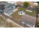 Aerial view of a backyard including fire pit and solar panels on roof at 9128 Suffield Ct, Tampa, FL 33615