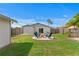 Well-maintained backyard with a fire pit area and privacy fence at 9128 Suffield Ct, Tampa, FL 33615