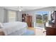Bright bedroom featuring sliding glass door access to the backyard and lots of storage at 9128 Suffield Ct, Tampa, FL 33615
