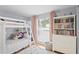 Cozy bedroom with a bunk bed, plush rug, and a large window for natural light at 9128 Suffield Ct, Tampa, FL 33615