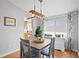 Cozy dining room with a stylish light fixture and view of the kitchen at 9128 Suffield Ct, Tampa, FL 33615