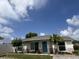 Charming single-story home featuring a well-manicured lawn and a welcoming front entrance at 9128 Suffield Ct, Tampa, FL 33615