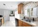 Bright kitchen featuring stainless steel sink, countertops, and modern appliances at 9128 Suffield Ct, Tampa, FL 33615