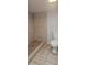 Bathroom with a tile shower and standard toilet at 9307 N 16Th St, Tampa, FL 33612