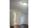 A bedroom featuring a glimpse into an open door to a bathroom at 9307 N 16Th St, Tampa, FL 33612