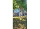 Cozy single-story home with a well-maintained front yard and mature trees at 9307 N 16Th St, Tampa, FL 33612