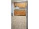 Traditional kitchen with wooden cabinets and granite countertops, complemented by tile floors at 9307 N 16Th St, Tampa, FL 33612