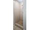 Tiled shower with tiled floor and a standard shower head at 9307 N 16Th St, Tampa, FL 33612