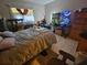 A bedroom featuring a large window and neutral-colored walls at 7535 Cypress Knoll Dr, New Port Richey, FL 34653