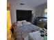 A bedroom featuring neutral-colored walls and a window with curtains at 7535 Cypress Knoll Dr, New Port Richey, FL 34653