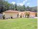Charming single-story home with a lush green lawn, mature landscaping, and an inviting facade at 7535 Cypress Knoll Dr, New Port Richey, FL 34653