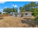 Backyard featuring a well-maintained lawn, modern patio, and a privacy fence, perfect for outdoor gatherings at 3300 52Nd N St, St Petersburg, FL 33710