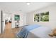 Bright bedroom with large window, ample closet space, and a view into the connecting living areas at 3300 52Nd N St, St Petersburg, FL 33710