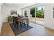 Dining room with stylish furniture, a large window overlooking the yard, and sliding door access to the yard at 3300 52Nd N St, St Petersburg, FL 33710