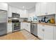 Beautiful kitchen with stainless steel appliances, butcher block counters, and modern backsplash at 3300 52Nd N St, St Petersburg, FL 33710