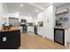 Modern kitchen features white cabinets, stainless steel appliances, and a butcher block island at 3300 52Nd N St, St Petersburg, FL 33710