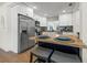 Close up of a modern kitchen with a butcher block countertop, a stainless steel dishwasher, and white cabinets at 3300 52Nd N St, St Petersburg, FL 33710