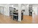Stylish kitchen island with seating and stainless steel appliances, with white cabinetry at 3300 52Nd N St, St Petersburg, FL 33710