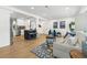 Bright and airy living room with an open floor plan, hardwood floors, and contemporary furnishings at 3300 52Nd N St, St Petersburg, FL 33710