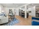 Open-concept living room with a kitchen island, stainless appliances, and comfortable seating area at 3300 52Nd N St, St Petersburg, FL 33710