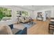 Sunlit living room with hardwood floors, comfortable seating, and a bright, airy feel at 3300 52Nd N St, St Petersburg, FL 33710