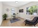 Functional home office space with natural light, a comfortable chair, and modern desk with an exterior view at 3300 52Nd N St, St Petersburg, FL 33710