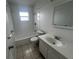 Bright bathroom featuring a bathtub, shower, and a classic white vanity sink at 103 Inwood Cir, Brandon, FL 33510