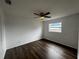 Cozy bedroom with new flooring, a ceiling fan, and a bright window at 103 Inwood Cir, Brandon, FL 33510