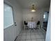 Cozy dining area featuring a table with seating and tiled floors at 103 Inwood Cir, Brandon, FL 33510
