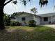 Charming home with a well-manicured lawn and lush landscaping, enhancing its appeal at 103 Inwood Cir, Brandon, FL 33510