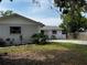 Charming home with well-maintained lawn and lush landscaping, enhancing curb appeal at 103 Inwood Cir, Brandon, FL 33510