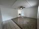 Bright living room featuring tile flooring, a ceiling fan, and neutral paint tones at 103 Inwood Cir, Brandon, FL 33510