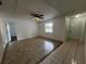Bright living room featuring tile flooring, a ceiling fan, and neutral paint tones at 103 Inwood Cir, Brandon, FL 33510