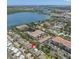 Aerial view of home near a lake, showcasing its location within a residential community at 10596 Lake Seminole Ter, Seminole, FL 33772