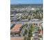 Aerial view of home with a pool, nestled in a residential area near city amenities at 10596 Lake Seminole Ter, Seminole, FL 33772