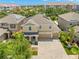 Exterior view showcasing a well-manicured home with solar panels and lush landscaping at 10596 Lake Seminole Ter, Seminole, FL 33772